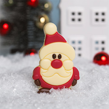 Św Mikołaj z mlecznej czekolady w świątecznej aranżacji