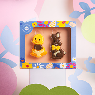 figurka kurczaka i zajaczka z czekolady na wielkanoc w ozdobnym opakowaniu